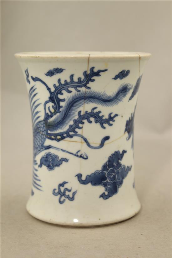 A Chinese blue and white waisted brush pot, Jiajing mark, Kangxi period, 13cm., broken and re-stuck